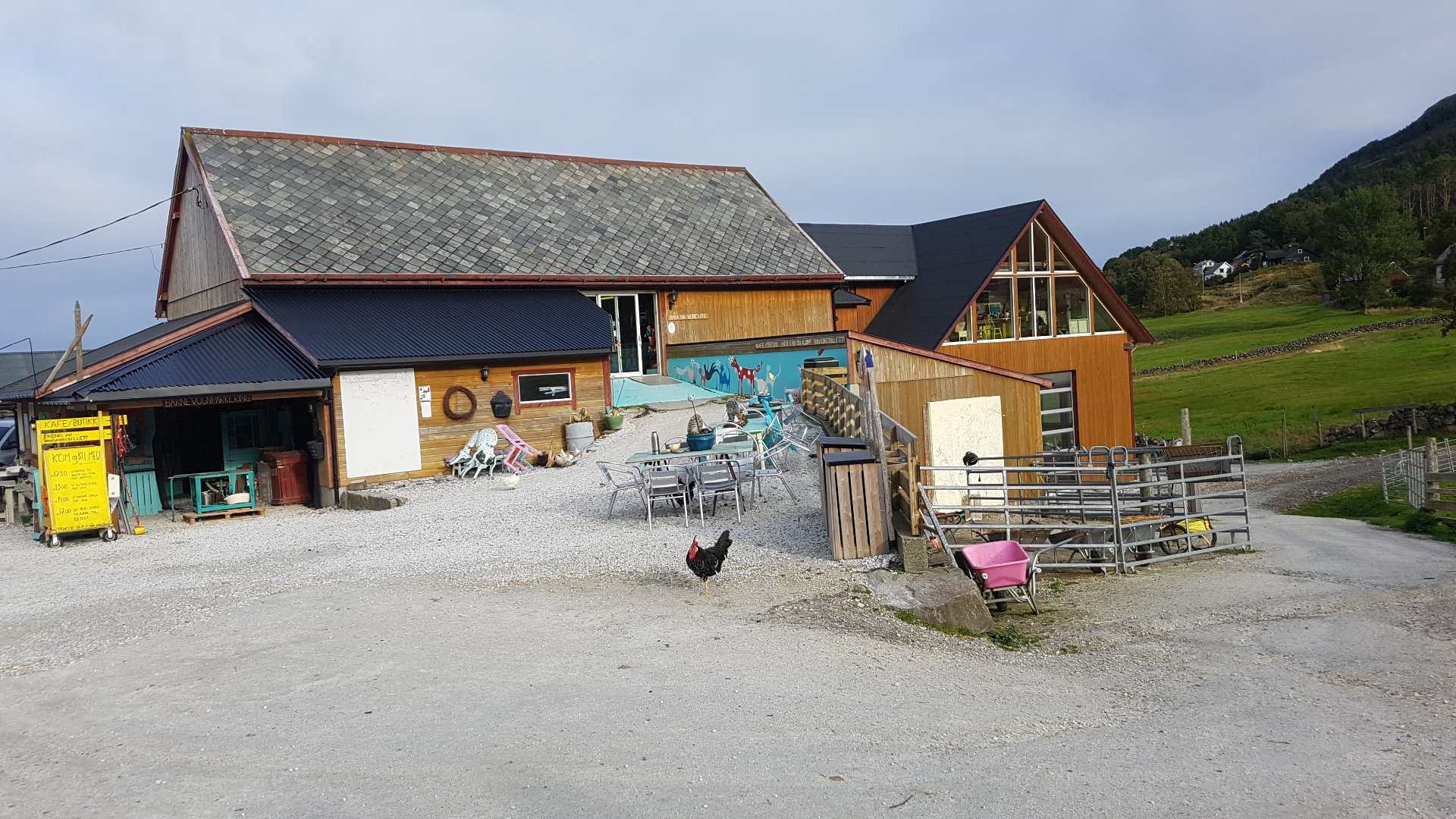 Hakallegarden with outdoor seating and wooden buildings