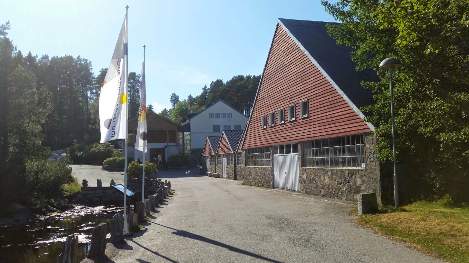 Sunnmøre Museum's main building with flags